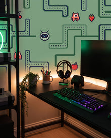 Fresque murale Level Up derrière un bureau gaming à éclairage RGB : papier peint arcade vert sur mesure Wonderwall