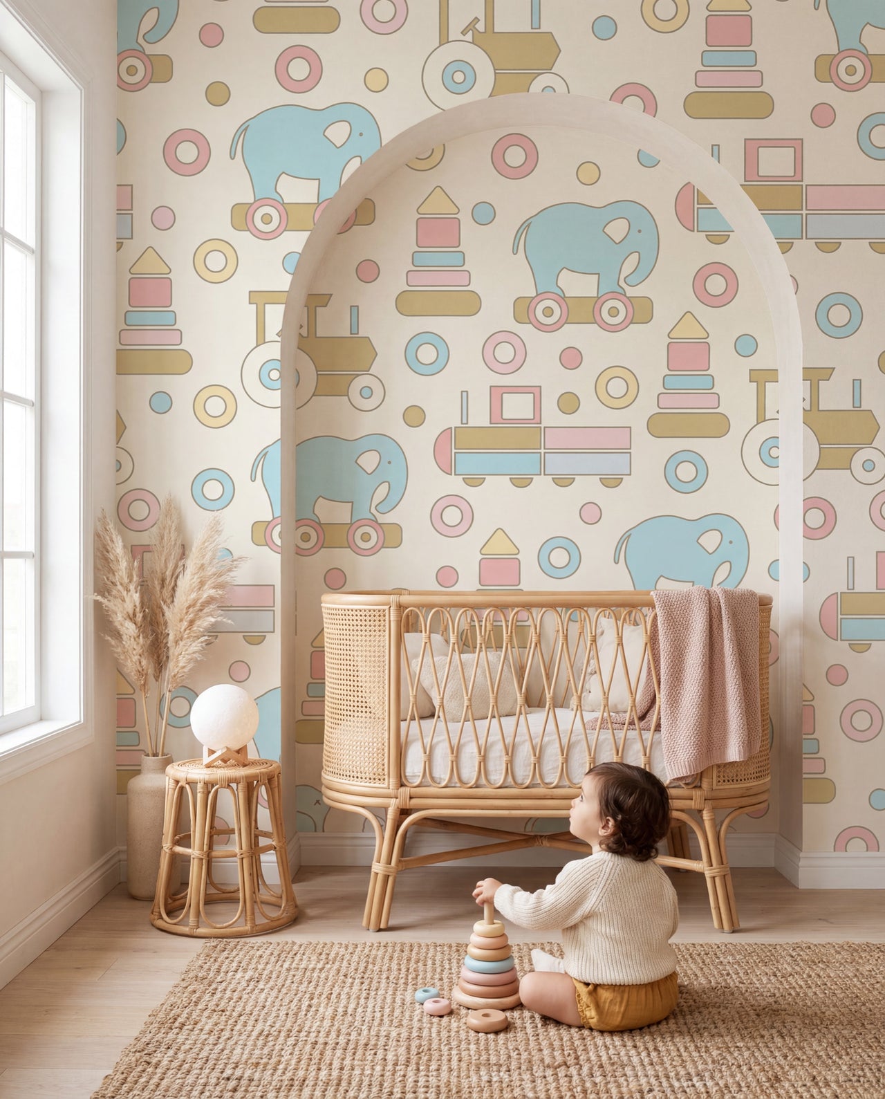 Papier peint Bilboquet dans une chambre de bébé, un tout-petit devant le mur aux jouets pastel, Wonderwall Casablanca