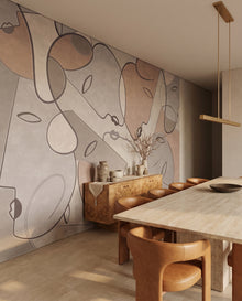 Fresque murale Terracina dans une salle à manger travertin et chaises cuir caramel : visages line art terracotta sur mesure au Maroc, Wonderwall