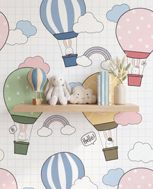 Détail du papier peint Alizé, montgolfière pastel portant un petit lapin, nuages et arc-en-ciel, Wonderwall Casablanca